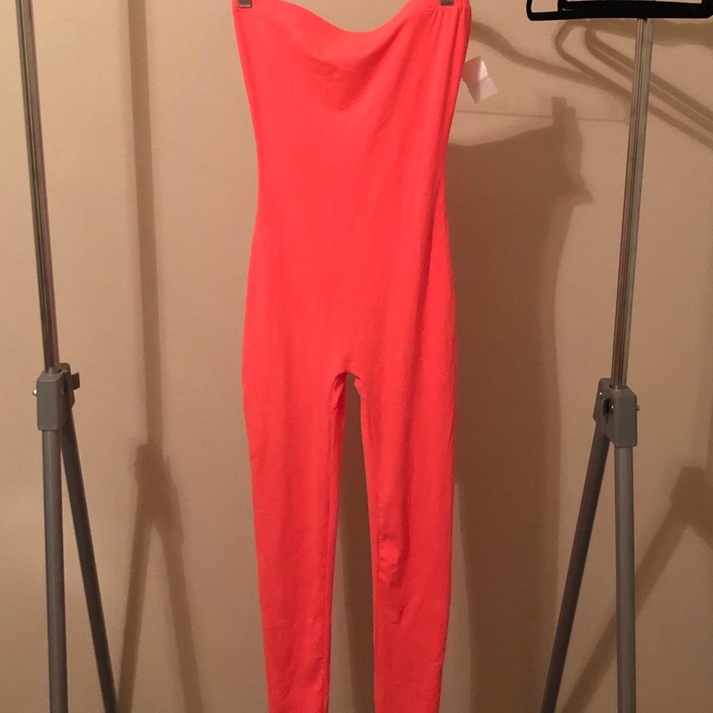 Neon pink body suit